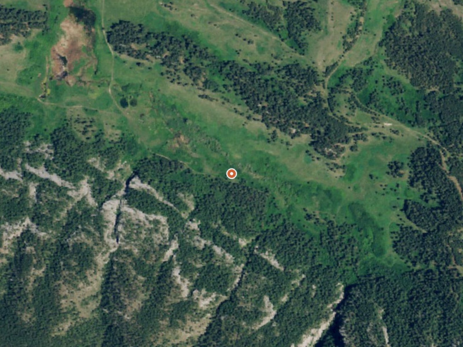 Aerial view of the ground around Lodgepole (Big Warm) Springs
